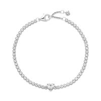 Bring elegance to your outfit with the Sparkling Pavé Tennis Bracelet. Hand-finished in sterling silver, this tennis bracelet is decorated with sparkling clear cubic zirconia. A large central heart-shaped stone punctuates a row of evenly sized pavé. The bracelet includes a lobster clasp for safe closure and can be adjusted to three lengths. Style it with other shimmering Pandora Timeless pieces for a classic look that stands out.