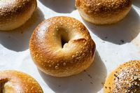 My recipe for a New York style sourdough bagel with a thin, crunchy crust, chewy interior, and golden brown color on the outside.