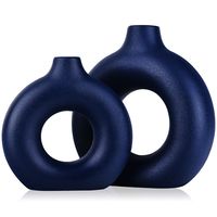 PRICES MAY VARY. 【Blue Decor Vase】Contemporary home decor is a widely popular mid-Century Modern Donut Hollow Vase, These small vases are perfect for your entryway, coffee table, shelf, mantle, accent table, and much more. They will look great no matter the season or Holiday! Create a space in your home with refined Fashion home décor accents, Create a warm atmosphere in your home. 【Blue Donut Vase】Our matte Circle Ceramic Donut vase 2 - Piece Set,They come in different shapes and sizes, Put tog