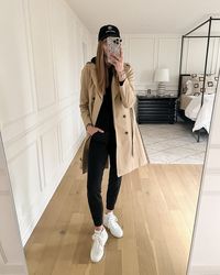 Fashion Jackson Wearing Jcrew Trench Coat Black Hoodie Sweatshirt Black Joggers White High Top Sneakers Black Baseball Hat, athleisure outfit with trench coat, black leggings and trench coat