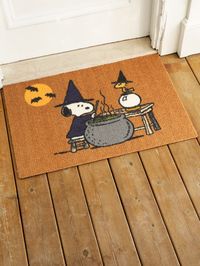 Make Halloween more magical with this fun doormat in an exclusive design featuring Snoopy and Woodstock cooking up mischief. Made of eco-friendly recycled polyester with a nonslip rubber backing, this mat is durable, long-lasting, and won’t shed, rot, or stain. It's ideal for any covered doorway or high-traffic area and easy to care for - just sweep, vacuum, spot clean, or rinse with a hose. Features an exclusive Peanuts print from the archives Made of eco-friendly recycled polyester Mimics the