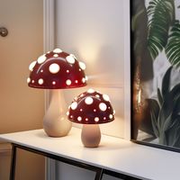 NATURE'S MAGIC x MODERN DESIGN Where nature's magic meets modern design. This lamp boasts a polished stem that mirrors the mushroom's authentic allure. Its lampshade, modelled after the mushroom's cap, radiates a gentle, inviting glow, setting a serene mood in any room. From your office desk to your cozy bedroom or chic living room, the Melita Lamp infuses a touch of wonder and elegance into your space. Choose between the convenience of cordless or the reliability of corded versions, ensuring it