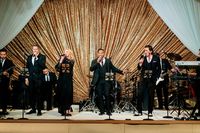 real wedding photo at four seasons los angeles at beverly hills wedding reception live band gold glitter backdrop drapery