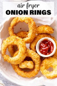 Crispy, crunchy Air Fryer Onion Rings are thick, flavorful, and coated with an unbelievably crispy golden panko crumb. Made with SO much less oil than regular onion rings!Recipe from Beaming Baker.