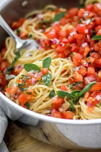 Bruschetta Pasta Salad is the perfect light and fresh summer pasta side dish you must try! Made by combining fresh bruschetta with spaghetti pasta this recipe uses the freshest ingredients, is one of the easiest to make and comes together in no time. Recipe is vegan and vegetarian friendly, and includes a step-by-step recipe video.