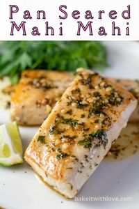 This pan seared Mahi Mahi recipe creates the most tender, flaky, and juicy piece of fish that any seafood lover will enjoy! It is ridiculously quick and easy, yet full of flavor! A simple sauce made from butter, lime, and cilantro makes this pan seared Mahi Mahi recipe extra special! BakeItWithLove.com #bakeitwithlove #best #mahimahi #fish #recipe #lime #cilantro