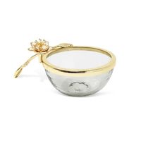 This elegant glass dish is highlighted by a gold enamel flower design on the handle. Perfect for special occasions or everyday use, the dish is an ideal way to serve food with style. The gold enamel detailing adds a luxurious touch to your table setting.