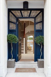 Luxury Interior Architecture and Design project by Katharine Pooley. Entrance doorway. Deep blue.