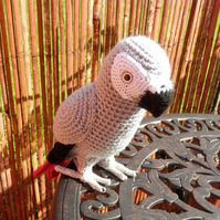 African Grey Parrot crochet PATTERN written in English with UK crochet terms. You will need to know how to double, half treble and treble crochet. Also to make a magic ring and slip stitch. You will need crochet hooks 2mm, 2.5mm and 3mm. The head and body of the parrot is made from an Aran weight yarn or you can use 2 strands of James C Brett Top Value DK100g ball in soft grey. This item is in PDF format and will be emailed to you after purchase. This pattern will make a parrot which measures ab