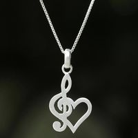 Jantana works with her sister to craft the necklace from sterling silver featuring a pendant in the shape of a heart and treble clef reflecting a love for music. The necklace arrives with an extender chain. The Thai artisan carries on the silversmithing traditions of her parents with the original design of this necklace.