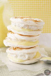 This take on lemon meringue pie is perfect for a warm day. Meringue cookies are sandwiched with graham cracker ice cream and lemon curd for a fun hand pie.