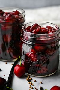 Vanilla Bean Pickled Cherries are tangy, sweet and tingly with a round vanilla finish. Use bing cherries for this easy pickled fruit recipe. #cherryrecipes #pickledcherries