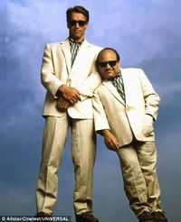 Twins in twin shades, twin shirts and twin cream suits.