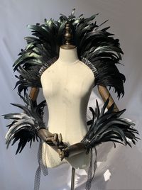 Material of the feather cape shawl: luxury layered feather and satin,4ply feather , so that it is thick 1920s feather shoulder wrap size: 25.6 inch long,10-12 inch wide; Ribbon band on each side: 29"; One size fits most with ribbon band.you can make it what you want,our feather shawls are long enough,you can wear it as a shawl over your dress, as a scarf, or as a hemline around your waist or hips Packing:we use a box, you can as a gift for your friends About Shipping: The link shipping cost by China Post , the shipping time about 15-30days , if you are urgent need it ,please contact with us to pay for fast shipping cost Feather Shawl: https://www.etsy.com/hk-en/shop/fkcraftfeather?ref=simple-shop-header-name&listing_id=1298467078&section_id=39119790 Feather boas: https://www.etsy.com/shop/