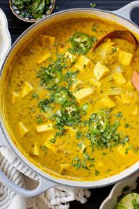 Comforting, healthy and delicious, this Tofu & Lentil Pumpkin Curry uses Indian-inspired flavors and is served up over rice for a comforting vegan dinner | ThisSavoryVegan.com #vegancurry #easycurry #pumpkinrecipes