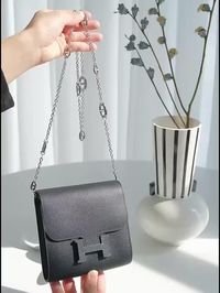 How to turn Constance slim wallet into a chic crossbody bag? By following these steps, you’ll easily transform your Constance slim wallet into a chic accessory that's perfect for the summer season! https://www.awulook.com/products/chain-strap-conversion-kit-for-constance-slim?_pos=2&_sid=e36db5cea&_ss=r #awulookstrap #hermes #constanceslim #hermesconstance #woc #summerfashion #crossbodybag