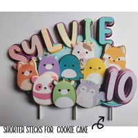 These Squishmallows have a way to anyone's heart!! They are especially perfect for a Birthday Cake or Cupcake Toppers. I have carefully created and perfected this unique toppers. This was a custom order, to match a special theme and look they were achieving! This cake topper is made out of a durable cardstock. With a fun 3D effect! This was a fun custom order, I received and love how it turned out! The cake topper has a clear plastic stick that easily can be poked right into the cake when your t