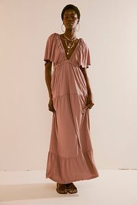 Forever free and flowy, this effortless maxi dress from our free-est collection is featured in a V-neck, tiered silhouette with flutter sleeves for added shape. * Soft, textured fabrication * Elastic empire waist * Effortless, pull-on style | La La Maxi Dress by free-est at Free People in Brown, Size: M