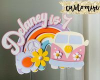 This handmade groovy rainbow cake topper features shades of lavender, orange, light blue and yellow. If you would like to customize your colors to match your party, message me! And yes, the bus moves :) Size: approximately 6 inches wide and 4.5 inches tall, not including sticks Other Groovy Items: https://www.etsy.com/shop/CraftingByNight?ref=seller-platform-mcnav&section_id=36816975 DISCLAIMERS: Please note that I take all photographs to best represent accurate colors, however, colors may diffe