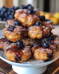 Find blueberry bliss in these Baked Blueberry Fritter Bites! Fresh blueberries baked into bite-sized fritters that are tender on the inside, crisp on the outside and coated in a sweet