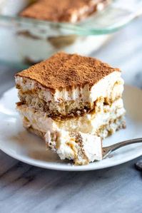 Creamy, delicious and unbelievably EASY tiramisu recipe made with coffee soaked lady fingers, sweet and creamy mascarpone, and cocoa powder dusted on top.