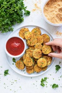 A few simple tricks make these Air Fryer Zucchini Chips the best! Cutting zucchini squash into slices gives you the perfect ratio of a crispy coating to tender zucchini. Plus, the combination of Italian seasoned bread crumbs and Parmesan cheese gives them so much flavor! Serve with your favorite marinara sauce or ranch dressing dip for a healthy adult and kid-approved recipe!