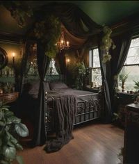 This is a great vision board idea for your new studio or bedroom! The black Canopy bed with the green walls is just *chefs kiss*