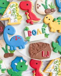 Butter Bar Bakery ~ Elana on Instagram: "Everybody ROAR!!! LJ is 4!!!! These four-rocious dinos stomped their way this special kids birthday. I love a good rhyming theme and I love Dino sets!!!! It’s always such a pleasure to be part of all your fun celebrations! 🦖🦕 #dinosaurcookies #dinocookies #fourociousbirthday #birthdaycookies #4thbirthdaycookies #fourocious #decoratedcookies #decoratedsugarcookies #cookiedecorating #cookies #cookiesofinstagram #sugarcookiemarketing #sugarcookies #sugarc