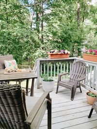 Pretty and simple decor for a smaller back deck! #backyardideas #smalldeck #deckideas #outdoordecorations #patiodeck