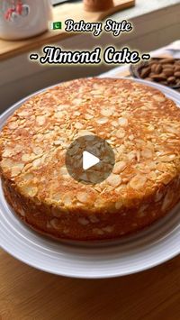 Khadeeja Hassan| Toronto Blogger🇵🇰🇨🇦 on Instagram: "~ Bakery Style Almond Cake ~

ingredients 
3 eggs room temperature 
Butter 1/3 cup ( unsalted and softened)
Oil 1/2 cup 
Sugar 3/4 cup
Baking powder 1 and half tsp 
Salt one pinch 
Flour 1 cup
Butter milk half cup ( mix half cup milk and 1 tsp vinegar) 
Vanilla extract 1 and half tsp 
Sliced almond 100 grams 

🥮 Method 

Beat eggs with sugar in high speed till creamy and colour changes. Then add butter with oil and beat till mixes well. Now pour buttermilk with vanilla and beat again for a minute. Sift dry ingredients and fold with spatula. Add chopped almonds 1/4 cup and fold again.

🥮 cake tin prep 
Butter 3-4 tbsp softened 
Almonds 80 grams 
Use 7 inches round tin and line with parchment paper then grease generously with softened