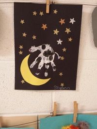 Preschool Hey Diddle Diddle art project. Cow jumping over the moon with their hand prints.