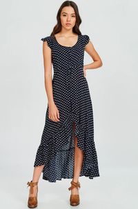 We're head over heels with affection for the Dotty & Me Navy Blue and White Polka Dot Maxi Dress! This woven dress is a sunny day favorite with its short, ruffle cap sleeves, and cute polka dot print. High-low bodice, with scoop neckline, tops a lightly flared maxi skirt with ruffle hem. Button loop front closure and cinched drawstring waist ensures a perfect fit.