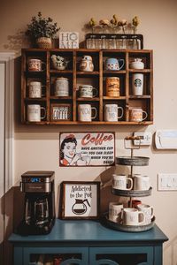 Display your coffee mugs, wine glasses, and decor on this super cute mug shelf. Pictured in the stain color of Provincial.  Physical Size: 34.5x4.5x21 approx finished dimensions weighing approx 12lbs upon completion. Need CUSTOM options or LOCAL pick up? Send us a message! Stain Finishes: Kona Ebony Grey Navy Dark Walnut Sunbleached Provincial *Please note: Stain colors may vary slightly due to variations in the wood. Have a special color request for a stain color? Send me a message and I will see if I can find a similar color! DISCLAIMER: These are handmade custom shelves meaning no two shelves are exactly alike. Shelves may differ in appearance slightly due to natural grains/knots in wood. Please note the back side of this shelf is not stained to completion because it is not visible when