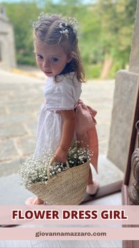 Elegant and romantic white linen flower girl dress with pink ribbon. Flower girl dress with sangallo lace around the neck and short sleeves. Linen dress girl for occasion, for baptism, wedding, first birthday.