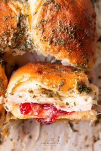 Ham and Cranberry Sliders are great to use with Thanksgiving leftovers or whip up as an appetizer for Super Bowl!