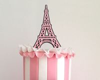 Handmade by FlyingOwlStudio on Etsy. This intricately designed Eiffel Tower Cake Topper is perfect for any Paris themed party! For a baby shower, girls birthday, bridal shower, and more - it's a fun and easy way to customize your party.  At 5" wide, it's just the right size for a 6" to 8" cake. If you require a different size, no problem, just ask. Pictured above in Rose Pink and Black, also available in any combination of our 40+ colours, it's your choice!