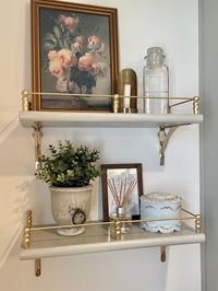 Using wood craft supplies and metallic paint- total cost of gallery rail was $21