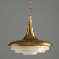 The Oluce Pendant Lamp is a unique addition to any room. Crafted from resin with an aesthetic of stillness, it is designed to be both eye-catching and peaceful. Resin for rooms of any style and size, its light-diffusing acrylic shade casts a beautiful, peaceful glow. If you have any questions about our products, please contact us and we will get back to you within 24 hours. Product Size Size: ∅ 17.7″ x H 15.7″ / Dia 45 cm x H 40cm Details Material: Metal, Resin Light source: LED bulb or Edison b