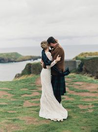 I love her dress and the fact that the tartan is draped over her shoulder - it doesn't appear tacky or over-the-top this way.