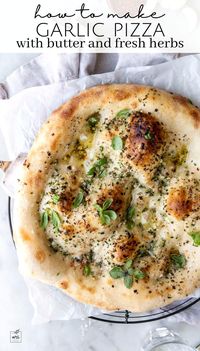 Whip up a delicious pizza in just 25 minutes with this mouthwatering recipe. Start with artisan pizza dough, then infuse it with the rich flavors of melted salted butter, chopped garlic, and a medley of fresh herbs like green onion, rosemary, and thyme. Add a sprinkle of flaky salt, freshly ground black pepper, and a dash of red pepper flakes for a hint of spice. Finish with a garnish of minced chives for a burst of freshness. For the full recipe, visit the link provided.