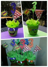 Retro TMNT Centerpieces With plastic green flower pots from Walmart hand painted with acrylic paint.