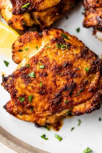 Unbelievably juicy Air Fryer Chicken Thighs with perfectly CRISPY skin! These easy chicken thighs are ready in less than 30 minutes, making them the ideal weeknight meal! A simple spice rub adds scrumptious flavor! #wellplatedrecipes #airfryerchicken #chickenthighs #airfryerchickenthighs #crispychickenthighs