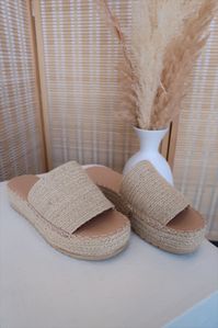 The Coconuts by Matisse Del Mar platform sandal is intricately made with rows of woven raffia, creating the upper and platform sole. This sandal also features a padded insole and tread bottom for comfort and security. PRODUCT DESCRIPTION AND MATERIALS: - Runs Small, recommend to size up - Upper: Raffia - Outsole: Man Made - Platfrom Height: 1.5" - Heel Height: 1.75" - Vegan - Man Made Lining - Padded Insole - Slip-On Entry - Imported RETURN POLICY: We offer refunds & exchanges within 15 days of