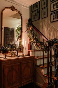 A step-by-step tutorial to photograph Christmas tree lights and candlelight at night to capture your home and decor in the holidays.