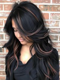 Adding rose gold highlights to deep black hair creates a romantic and trendy look. This style is perfect for individuals who wish to add a touch of elegance to their everyday appearance. The rose gold complements darker skin tones beautifully and can elevate a simple hairstyle to something extraordinary for special occasions.