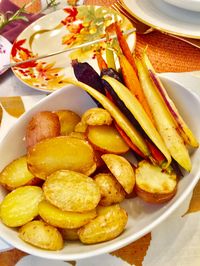 In Mürren our cheese fondue was served with cubes of bread (which we also had) and boiled potatoes.  I chose to roast rather than boil my potatoes (for more flavor) along with roasted small carved rainbow carrots.