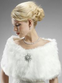 White Faux Fur Bridal StoleAdd an extra touch of elegance to your wedding or special occasion with this beautiful white faux fox fur wrap. This glamorous wrap will add warmth and glamour to your ensemble, making it a must-have addition to your Fall or Winter event. The wrap includes a hook and eye closure. (Brooch shown is not included.)A beautiful accessory for your wedding day, prom or quinceanera!Size: about 48" wide and x 11" high.Color: White.Style: W116-W.You can find the glamorous cz jewe