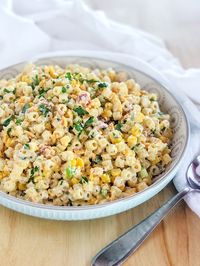 Crack pasta salad made with corn, bacon, cheese, jalapeno pepper, spring onions and a light, lemony ranch dressing! The perfect summer pasta salad!