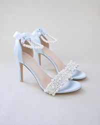 "Classic satin high heel sandals adorned with allover pearls on the vamp and pearl ankle strap for romantic, elegant and feminine look. The delicate pearl beads are placed to create a graceful classic style. Simple and easy wear for bridal wear, bridesmaids, holiday party, wedding parties, and any special occasions.  DETAILS: HEEL HEIGHT: 3.5 Inches COLORS AVAILABLE: White, Ivory, Light Blue, Champagne, Fuchsia UPPER: Synthetic upper and lining MATERIALS: Manmade outsole STYLE NAME: DEMI Not sure of which size to purchase? Shoes measurements are as follow: (Please note measurements taken the length of inside of shoe from toe to heel). Size 6 - 9.25\" Size 7 - 9.5\" Size 8 - 9.75\" Size 9 - 10\" Size 10 - 10.25\" Size 11 - 10.5\" Please note all these info are intended for general reference