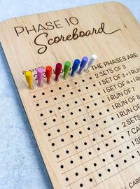 Phase 10 Score Board. Keep track of everyone's score with this handy scoreboard! Includes board and 8 colored pegs, pegs will vary in color. Laser cut and engraved on maple. Board measures 8.5" x 11".  Please note: All games are hand painted and assembled to order, making each one unique. Since each piece of wood takes to paint or stain slightly differently, no two games will be exactly alike. Colors on your screen may vary slightly from the colors in person. I love custom orders! If you'd like to discuss a different size or color options please message me before ordering.